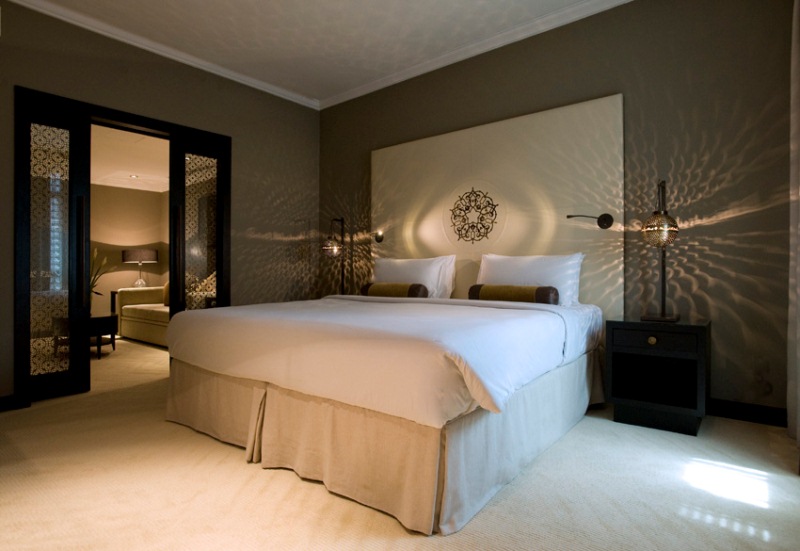 Madinah hotel bedroom with warm lantern lighting and decorative patterns